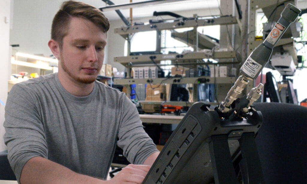 Engineer assembling Ninja hardware in production lab